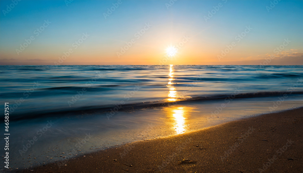 ocean sunrise over beach shore and waves the sun is rising up over sea horizon