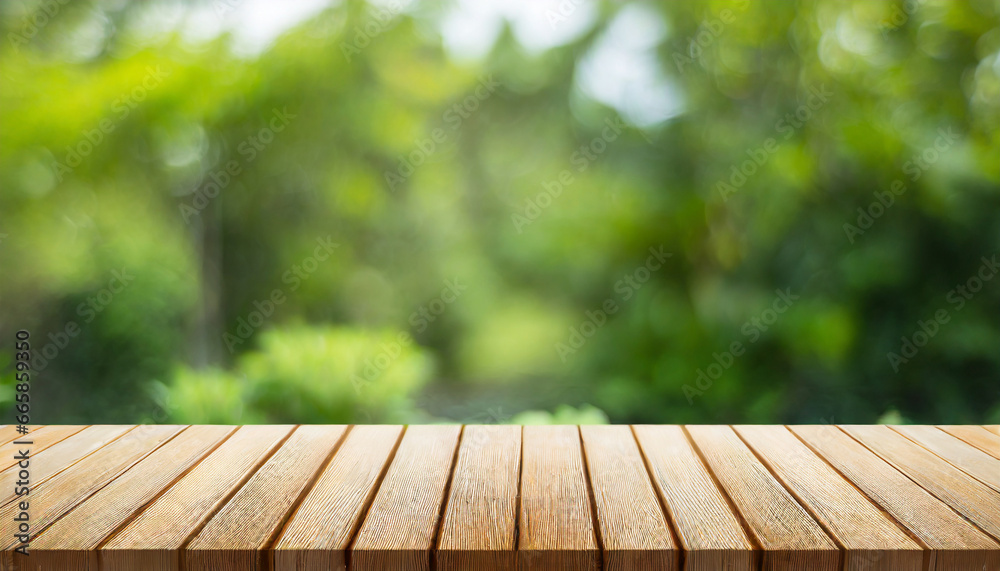 wooden table and blurred green nature garden background