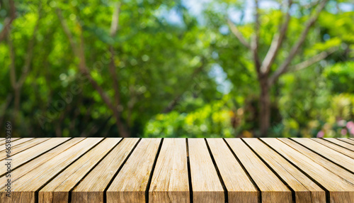 wooden table and blurred green nature garden background