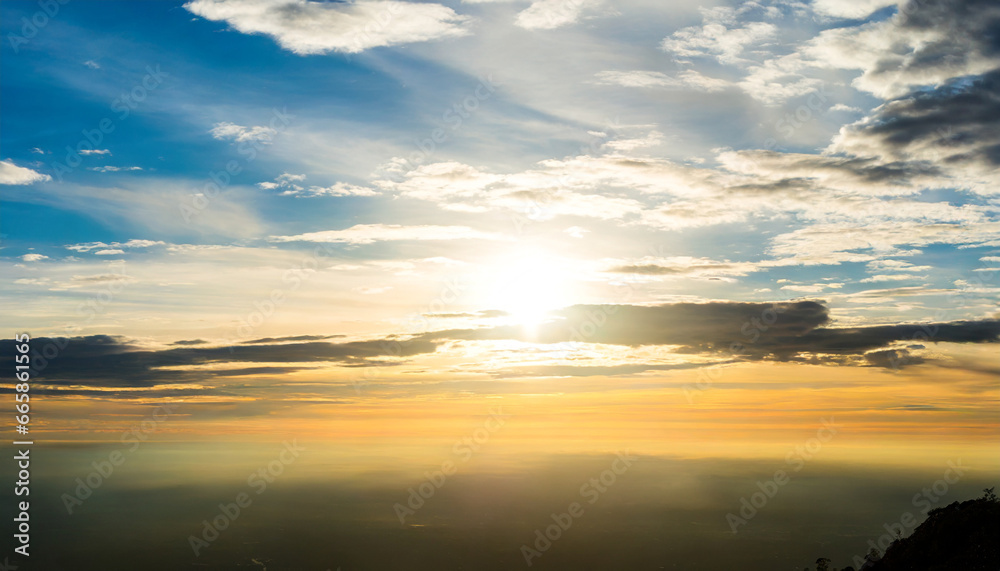 cloudy sky and bright sunrise over the horizon