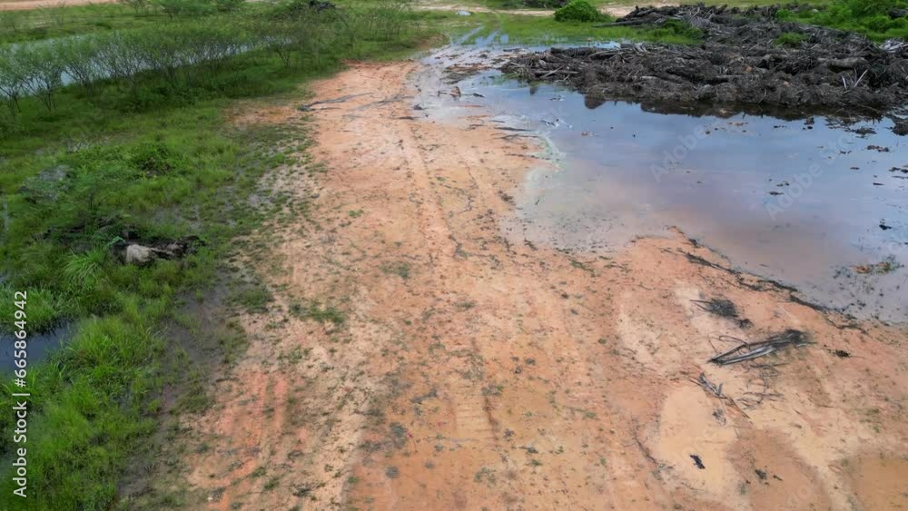 Aerial view red clay soil and land clearing at wetland Aerial view red clay soil and land clearing at wetland