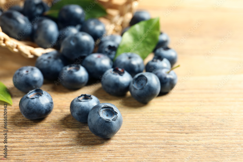 Fresh tasty blueberries on wooden table, closeup. Space for text Fresh tasty blueberries on wooden table, closeup. Space for text