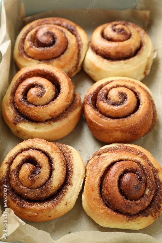Tasty cinnamon rolls in baking dish, closeup Tasty cinnamon rolls in baking dish, closeup