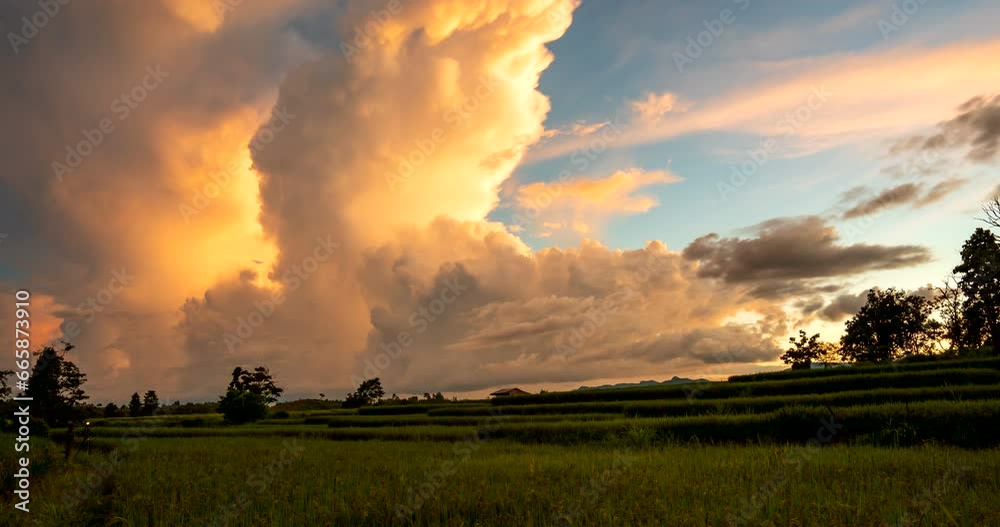 Amazing Time lapse of the sunset sky with spectacular clouds over the rice terrace field and changing color sky and clouds. Amazing Time lapse of the sunset sky with spectacular clouds over the rice terrace field and changing color sky and clouds.