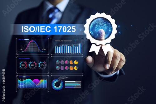 Businessman pointing on ISO IEC 17025 Laboratory management System with data chart testing result and Calibration measuring instrument assurance certified body to approve certificate on industry photo
