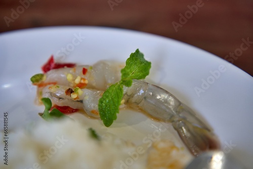 The Close-up photo of shrimp soaked in fish sauce, spicy sauce