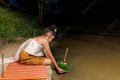A young woman wearing an ancient Thai dress on the day of the Loi Krathong Festival