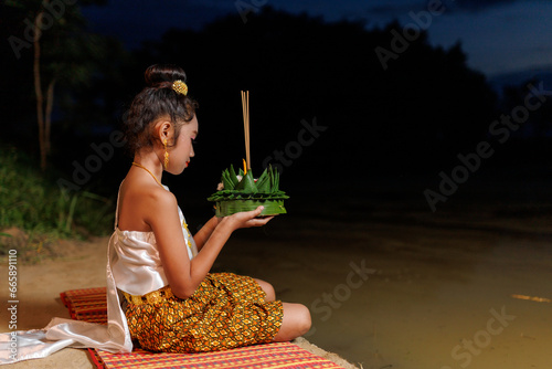 A young woman wearing an ancient Thai dress on the day of the Loi Krathong Festival