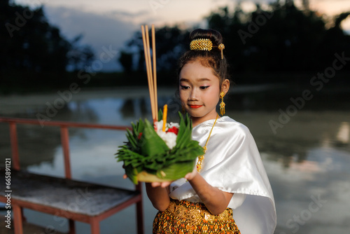 A young woman wearing an ancient Thai dress on the day of the Loi Krathong Festival