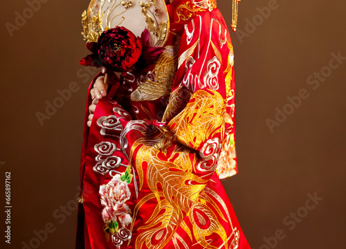 Asian costume woman holding paper umbrella