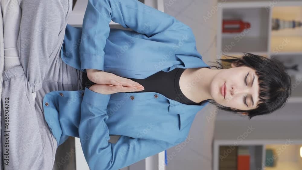 Vertical video of The meditating young woman.