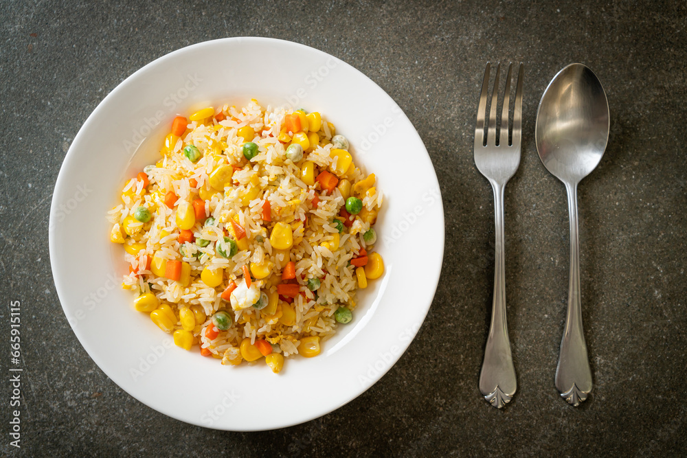 fried rice with mixed vegetable (carrot, green bean peas, corn) and egg fried rice with mixed vegetable (carrot, green bean peas, corn) and egg