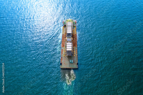 Top view Logistics and transportation large cargo ship Transporting loads of oil rig parts © boygek