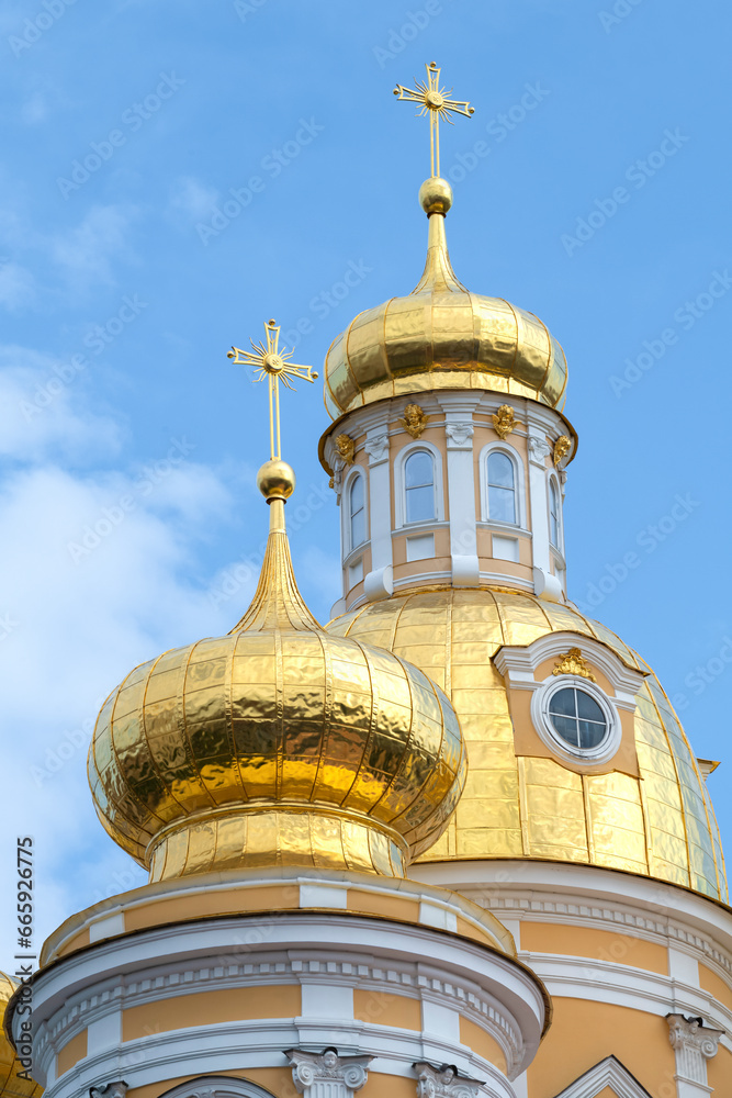 Two domes of the ancient Cathedral of the Vladimir Icon of the Mother of God on a sunny day. Saint-Petersburg, Russia
