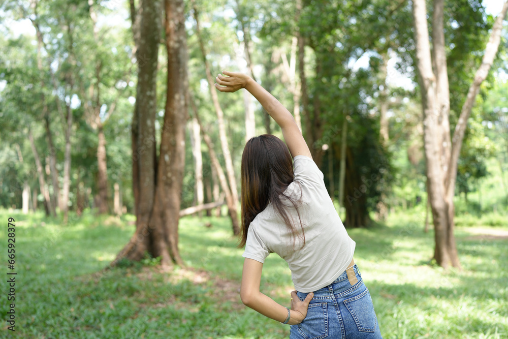 world saving concept Happy female tourist amidst forest world saving concept Happy female tourist amidst forest