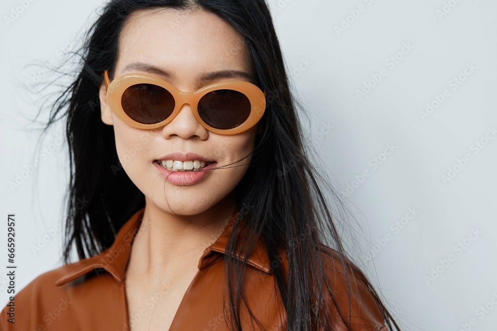 Woman asian model beauty portrait sunglasses vacations lifestyle beige fashion hair glamour Woman asian model beauty portrait sunglasses vacations lifestyle beige fashion hair glamour