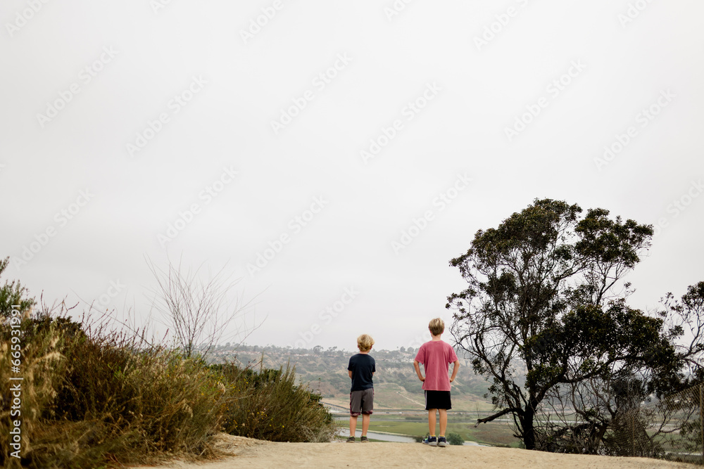 Brothers Standing at Overlook While Hiking in San Diego Brothers Standing at Overlook While Hiking in San Diego