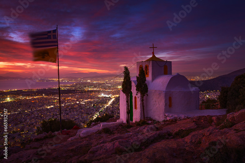 Prophetess Ilias church and view of Athens at dusk. photo