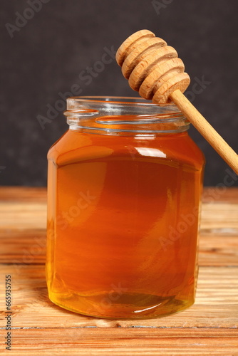 Jar of Honey with Honey Dipper photo