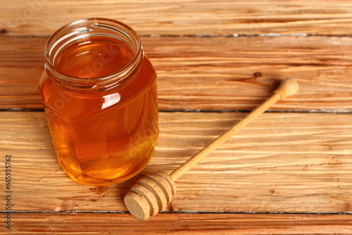 Jar of Honey with Honey Dipper photo