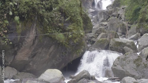 amazing tall waterfall in the forest photo