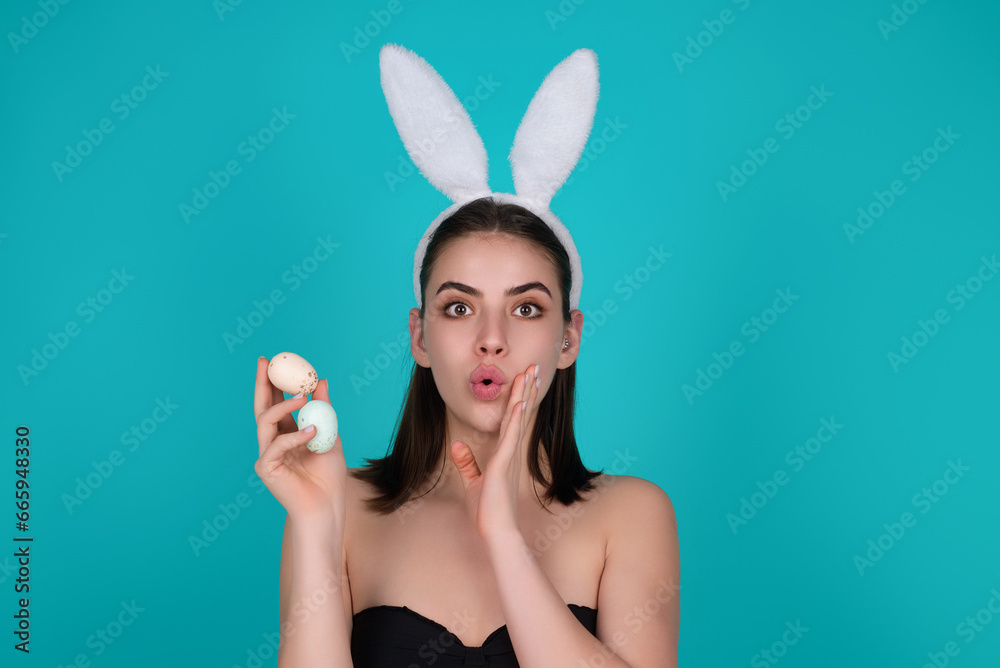 Beautiful young woman with bunny ears on studio color background. Easter funny woman with rabbit ears. Portrait of a pretty lovely girl with bunny ears. Beautiful young woman with bunny ears on studio color background. Easter funny woman with rabbit ears. Portrait of a pretty lovely girl with bunny ears.