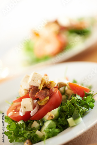 Plate, closeup and a salad on a table for lunch, nutrition or eating to a a diet. Zoom, health and vegetable, dinner and an arrangement of food for detox, cooking or hungry with a dish for brunch