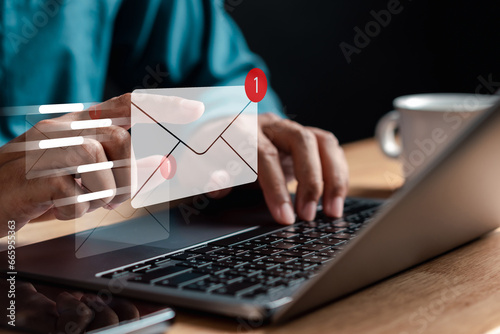 Businessman sending email to customer, business contact concept.