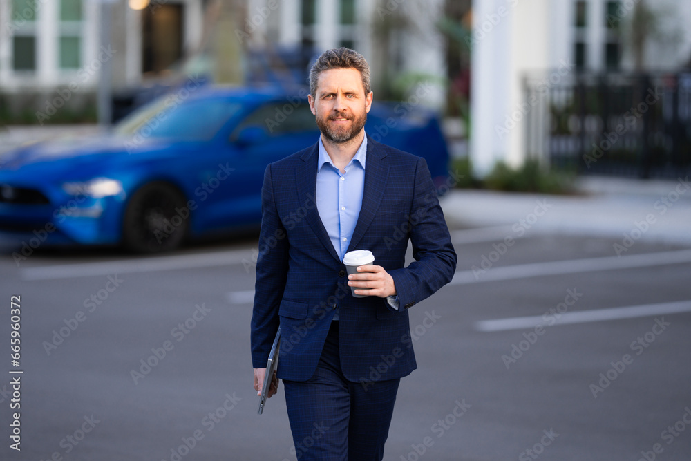 Business man in suit walk outdoor in street. Businessman in city. Business man in suit go to office work. Business people. 40s office worker. Outdoor portrait of businessman near office building. Business man in suit walk outdoor in street. Businessman in city. Business man in suit go to office work. Business people. 40s office worker. Outdoor portrait of businessman near office building.