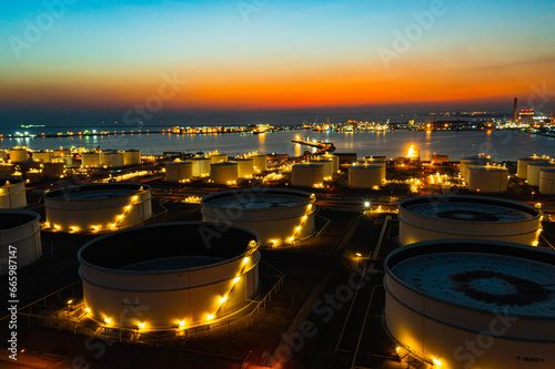Aerial view oil tanker. oil loading dock of business logistic sea going ship, crude oil tanker lpg ngv at night, Group oil tanker ship to Port of singapore - cargo ship import export
