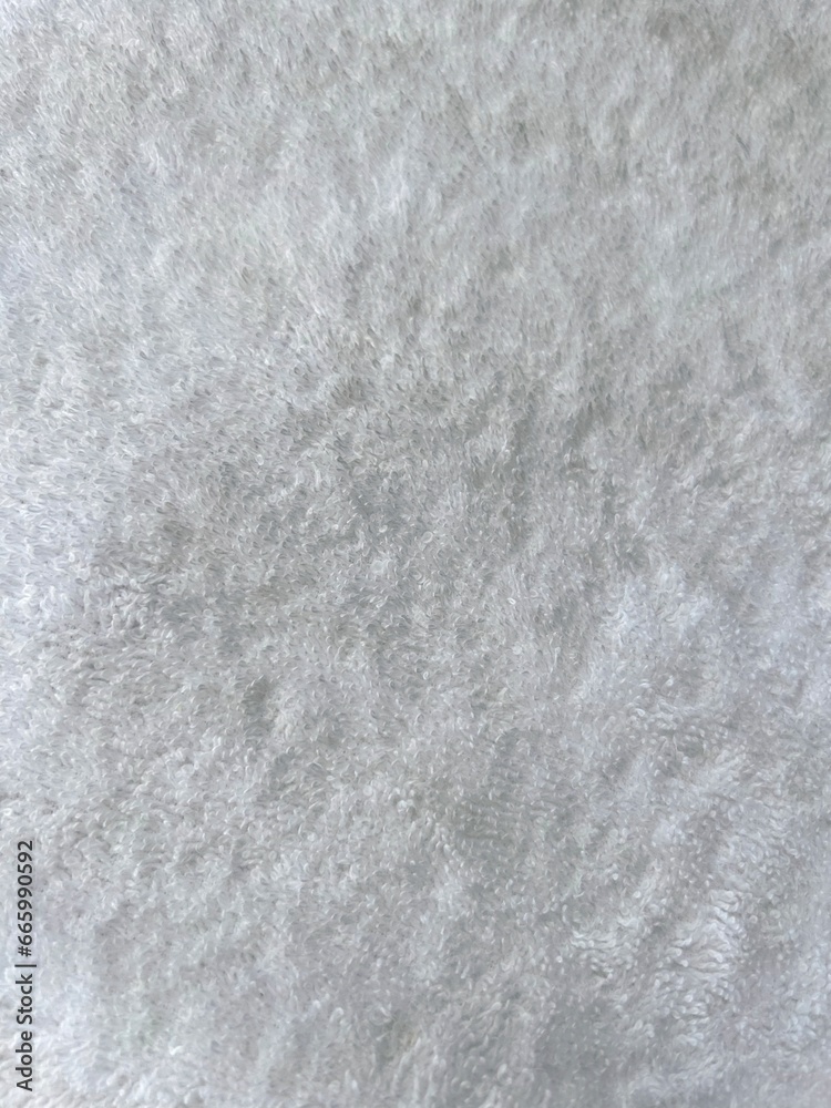 Grey abstract background with fur pile. Fur cloth. Gray fluffy textile surface, fur fabric. Abstract fabric background. Fluffy texture. Grey carpet texture. High quality photos
