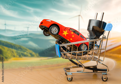 Photography Toy car with the chinese flag and electrical plug inside a small shopping cart