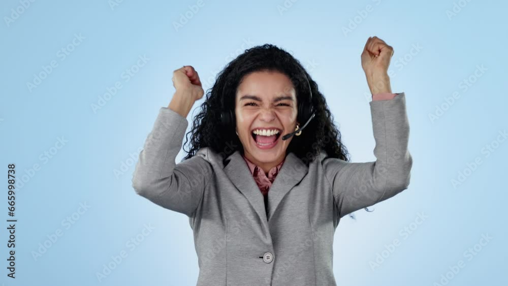 Business woman, winner and call center celebration, success or excited for sales or bonus in studio. Face of telemarketing agent with wow, yes and happy for promotion or news on a blue background Business woman, winner and call center celebration, success or excited for sales or bonus in studio. Face of telemarketing agent with wow, yes and happy for promotion or news on a blue background