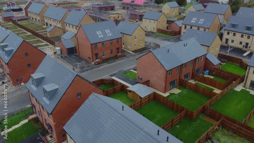 Drone 50fps. New build house. Housing development, construction site, new modern family houses. Filmed Manchester. UK.