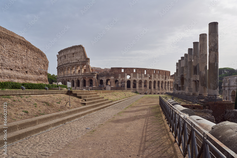 Morning view of the Colosseum (Colosseo, Anfiteatro Flavio) from the Roman forum in Rome, Italy	