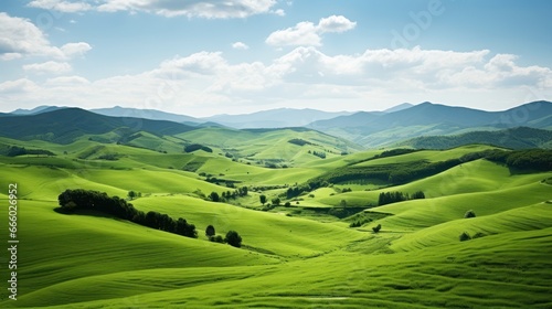 Vast fields of green undulate under the breeze  epitomizing the beauty of rolling countryside and meadows
