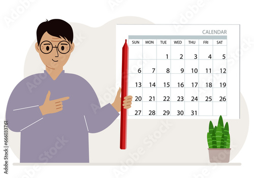 A man with a pencil in his hand creates a calendar. Planning and time management, responsible employee plans meetings and events.