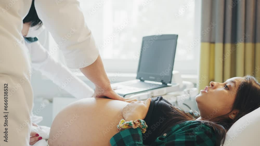 Pregnant woman is happy visit gynecologist for pregnancy consultant. Concept Prenatal care and pregnancy. Doctor examine pregnant healthcare check up for baby and mother at hospital or clinic Pregnant woman is happy visit gynecologist for pregnancy consultant. Concept Prenatal care and pregnancy. Doctor examine pregnant healthcare check up for baby and mother at hospital or clinic