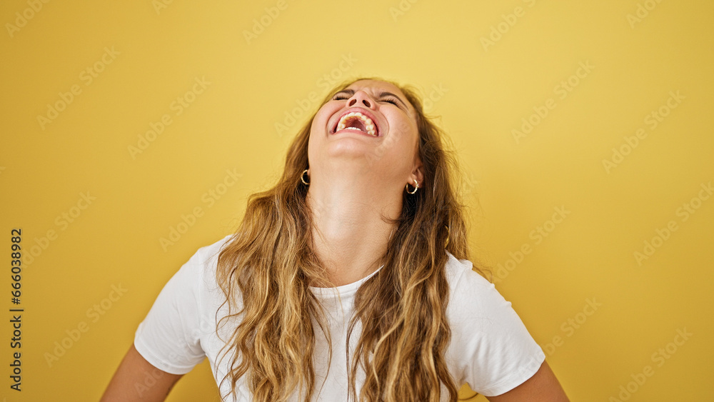 Young beautiful hispanic woman laughing a lot standing over isolated yellow background Young beautiful hispanic woman laughing a lot standing over isolated yellow background
