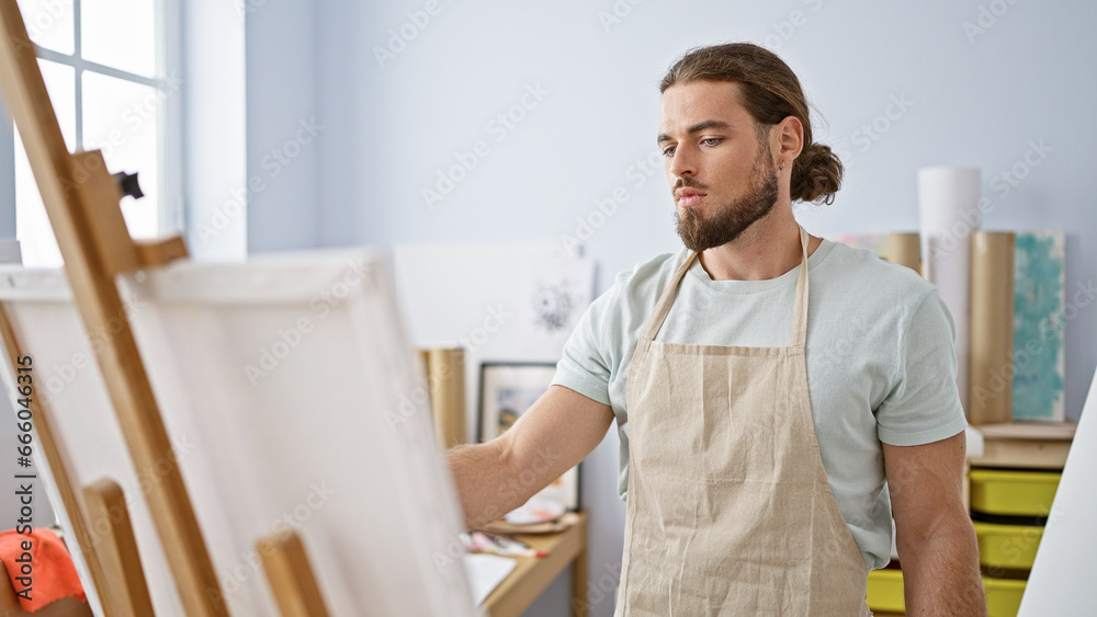 Young hispanic man artist drawing at art studio Young hispanic man artist drawing at art studio