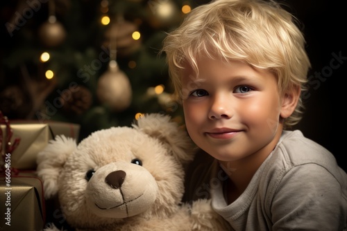 Winter holidays concept. Generative AI. Happy childhood. A little European boy with a teddy bear near the Christmas tree in a cozy home interior.