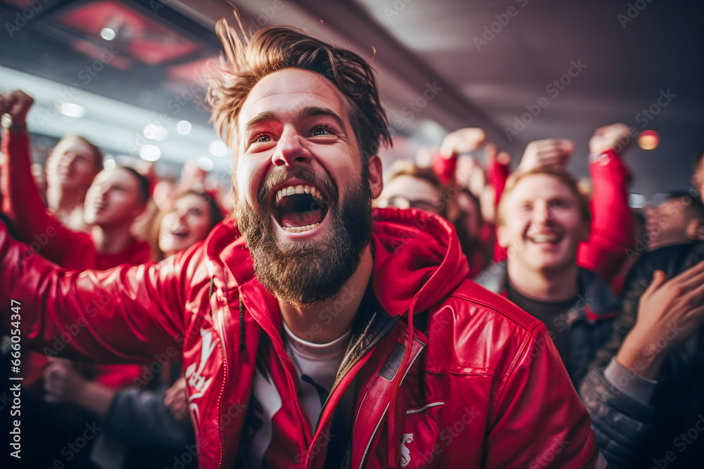 the world of soccer celebrating in a stadium showing cheering young brunette man with beard