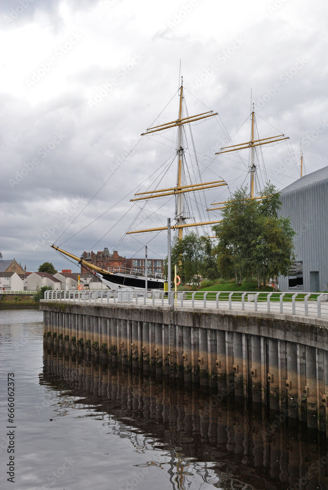 View of Riverside with Modern Pilings and Old Sailing Ship View of Riverside with Modern Pilings and Old Sailing Ship