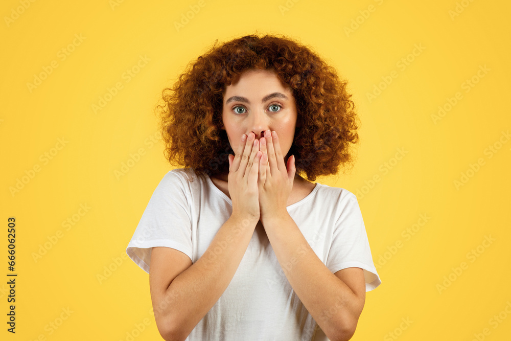 Shocked scared teen caucasian woman, covers face with hands Shocked scared teen caucasian woman, covers face with hands