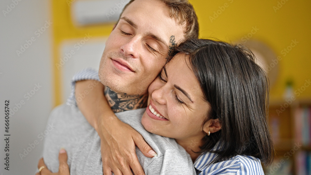 Beautiful couple smiling confident hugging each other kissing at home Beautiful couple smiling confident hugging each other kissing at home