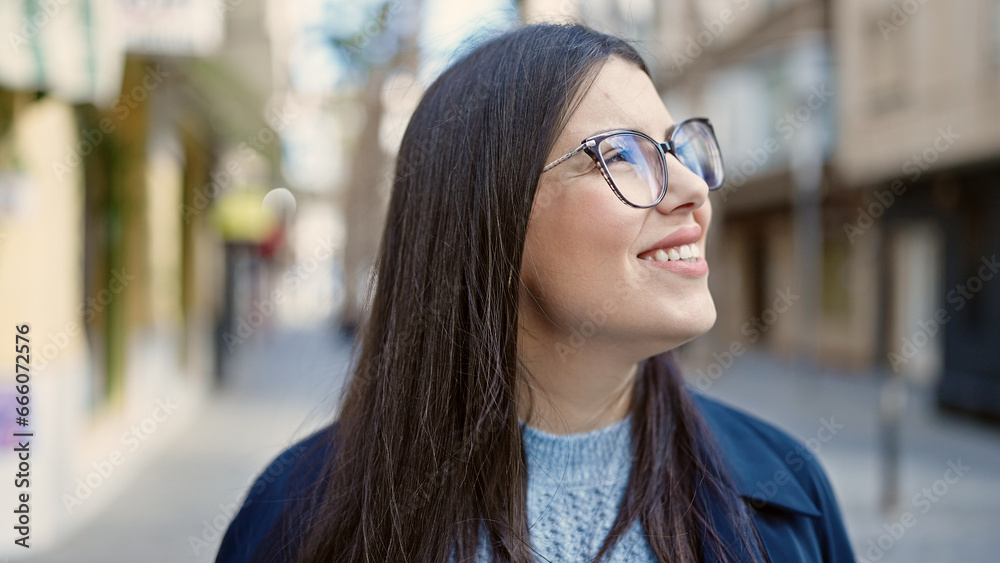 Young hispanic woman smiling confident looking up at street Young hispanic woman smiling confident looking up at street