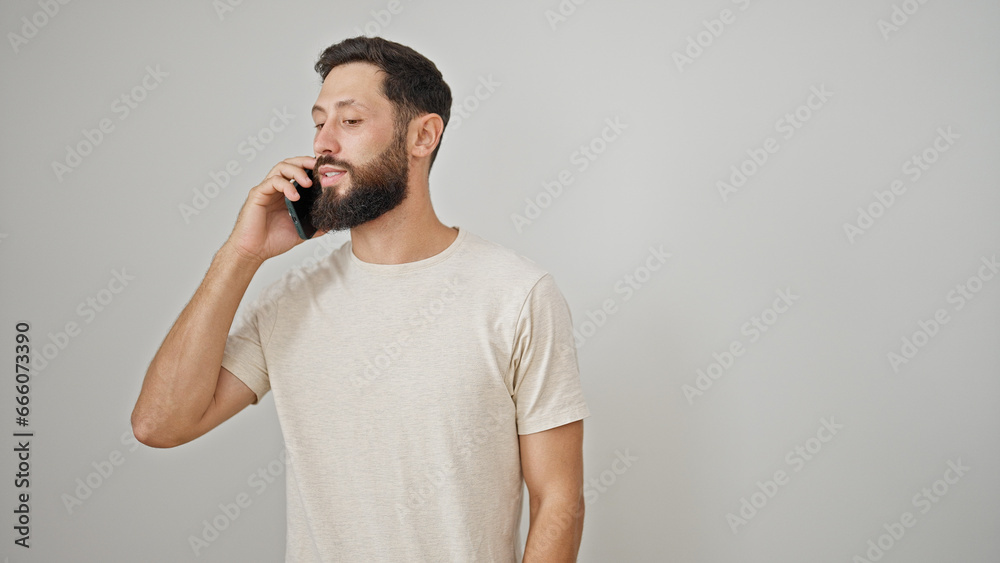 Young hispanic man talking on the smartphone over isolated white background Young hispanic man talking on the smartphone over isolated white background