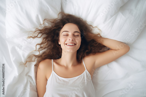 Portrait of a beautiful woman sleeping in a bed with white bedding