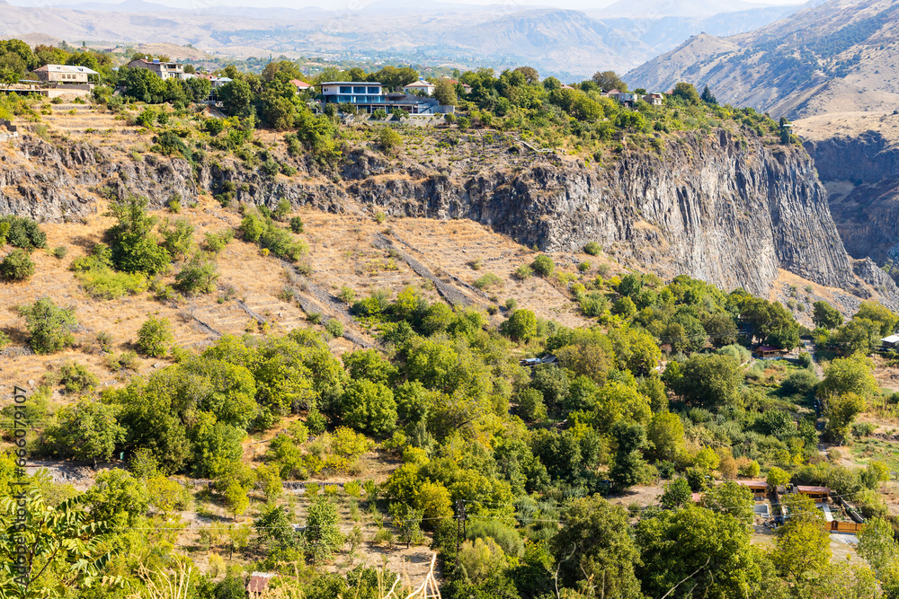 Fototapeta premium houses of village of Garni on cliff over of Azat River gorge in Gegham mountains of Armenia