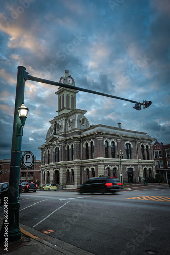 Traffic light post ad street lights on Main Street Georgetown, Kentucky in front of Scott county courthouse after sunset photo